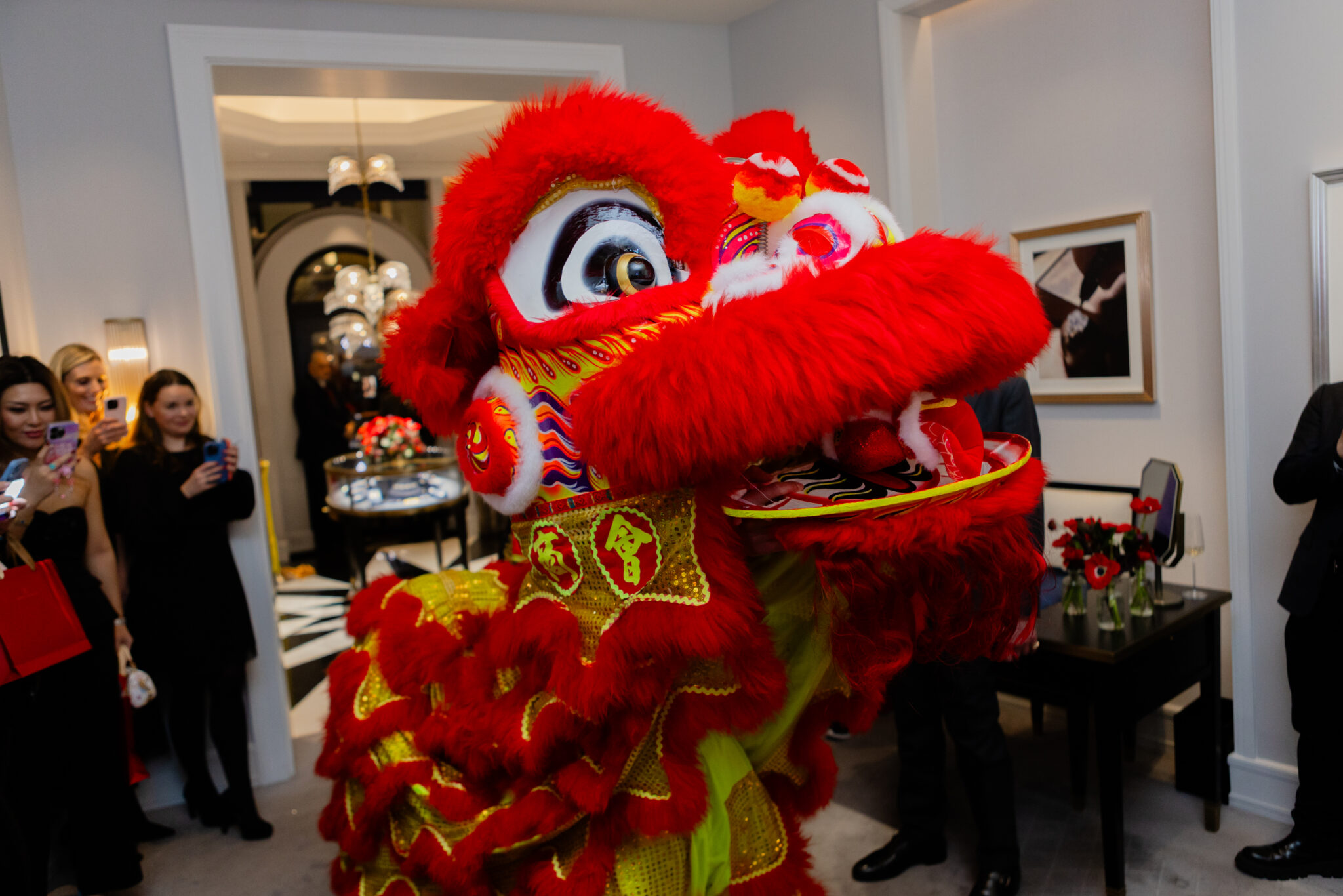 chinese lion costume face dancing in crowd of people