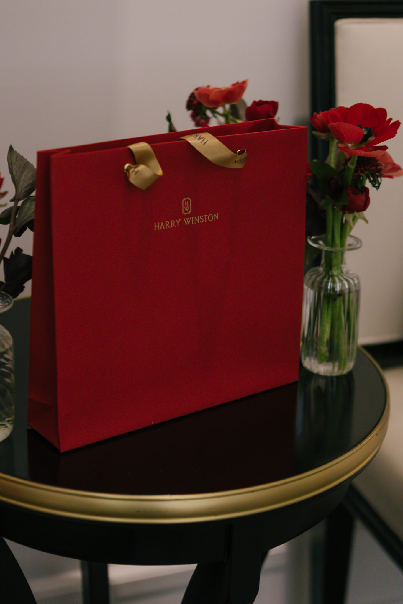 Red branded gift bag on table